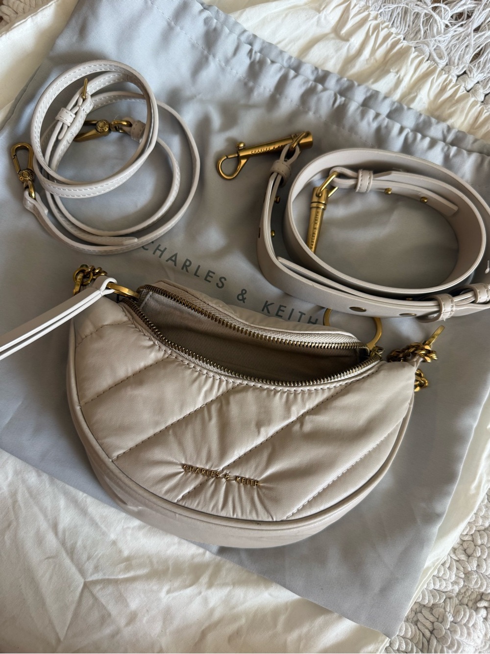 Charles & Keith Cream Quilted Crescent Shoulder Bag with Gold Hardware